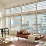 Thumbnail of http://a%20living%20room%20filled%20with%20furniture%20and%20windows%20covered%20in%20blinds