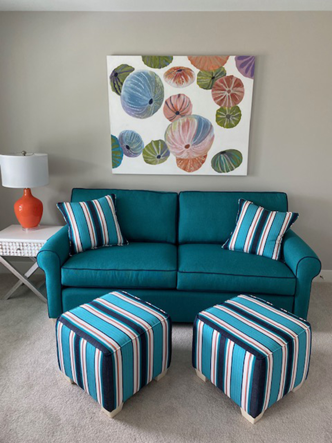 a blue couch and ottoman in a living room