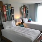 Thumbnail of http://two%20beds%20in%20a%20room%20with%20skis%20on%20the%20wall