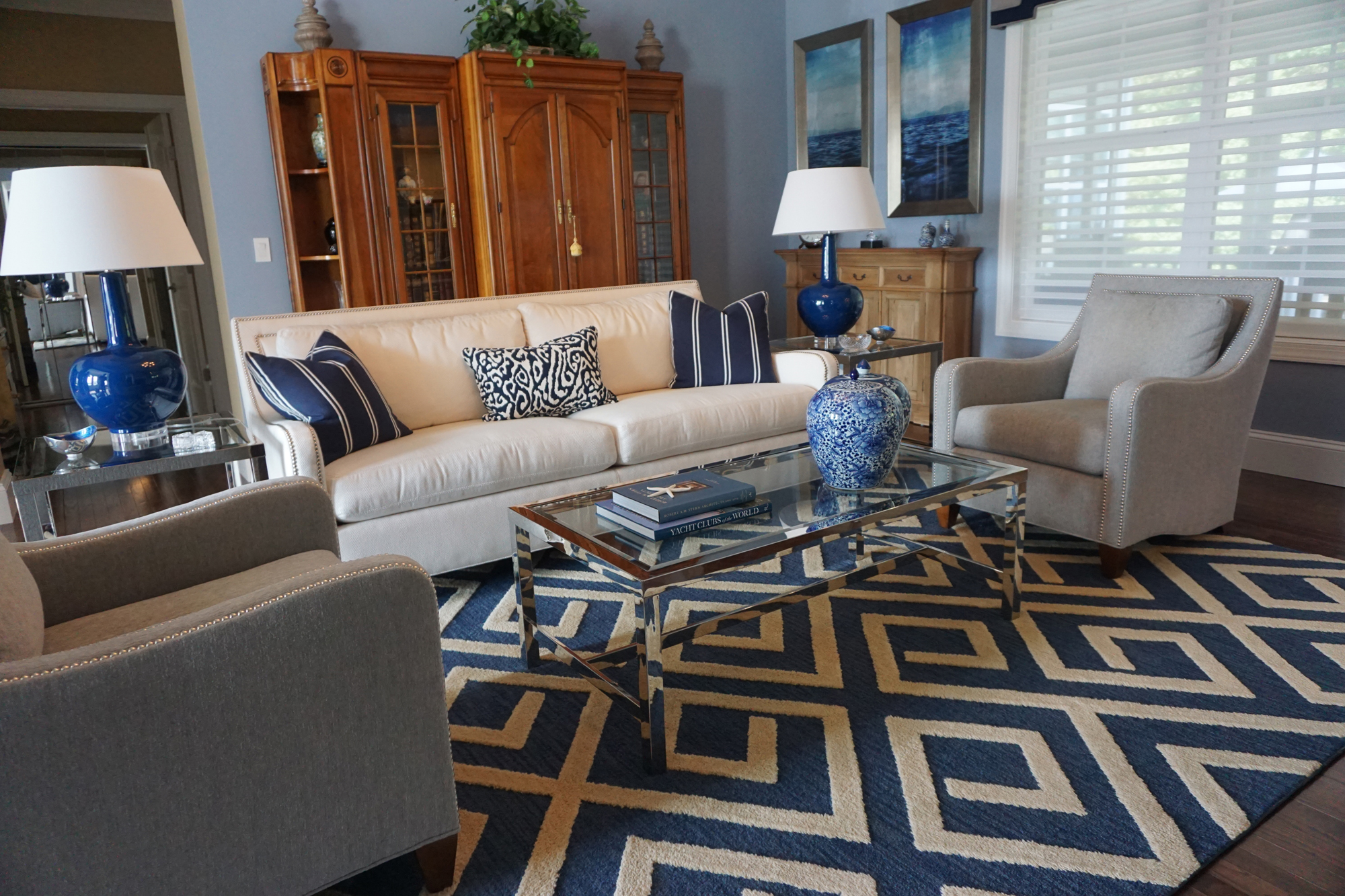 a living room filled with furniture and blue accents