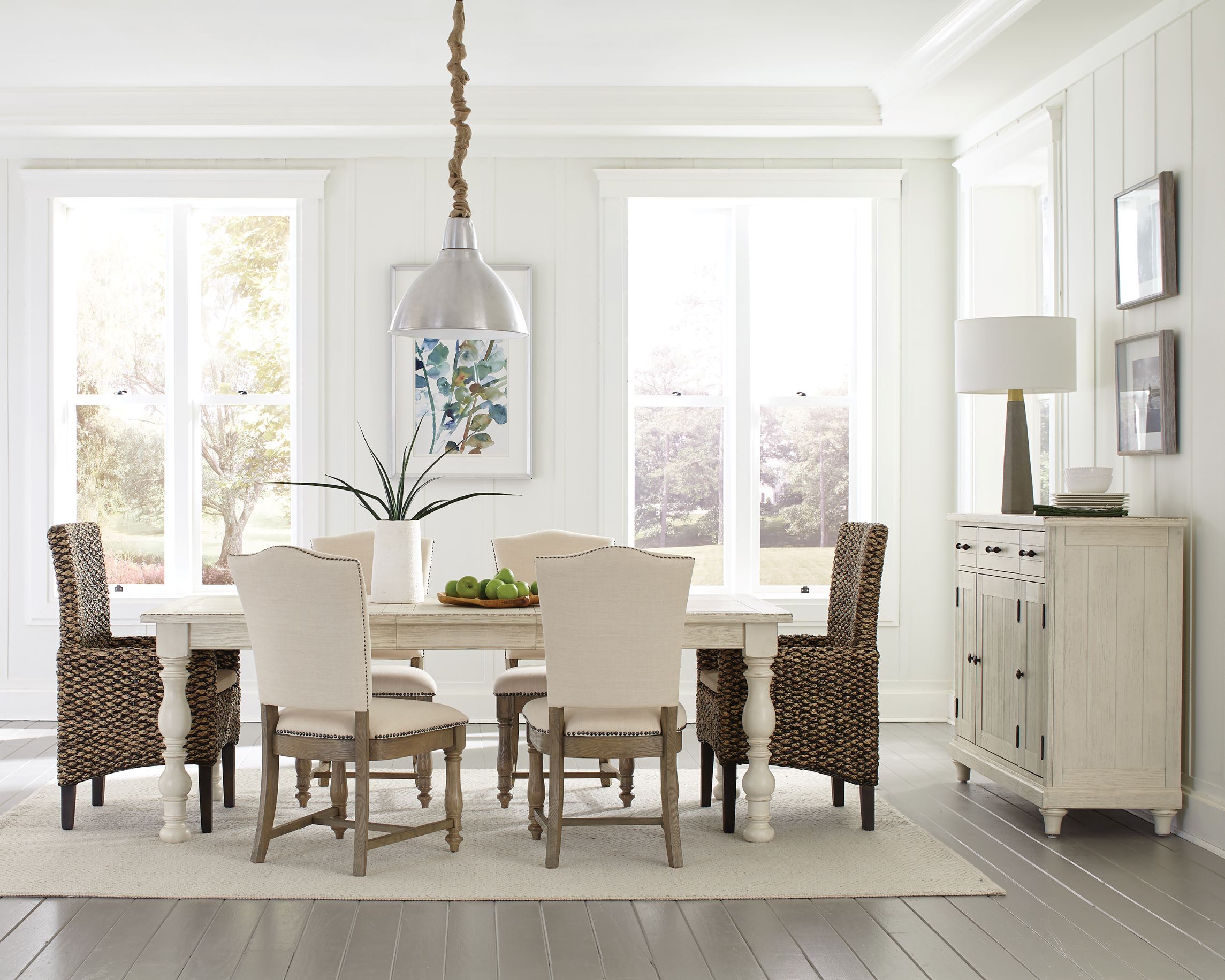 a dining room table and chairs with white walls