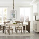 Thumbnail of http://a%20dining%20room%20table%20with%20chairs%20and%20a%20white%20rug