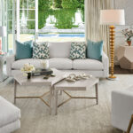 Thumbnail of http://a%20living%20room%20filled%20with%20white%20furniture%20and%20lots%20of%20windows