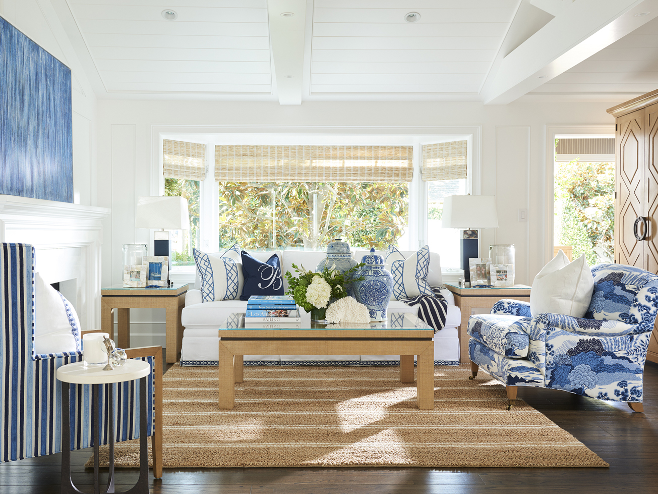 a living room with blue and white furniture