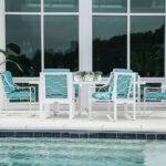Thumbnail of http://a%20table%20and%20chairs%20sitting%20next%20to%20a%20swimming%20pool