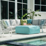 Thumbnail of http://a%20couch%20sitting%20next%20to%20a%20swimming%20pool