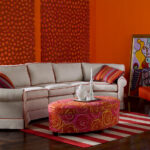 Thumbnail of http://a%20living%20room%20with%20orange%20walls%20and%20furniture