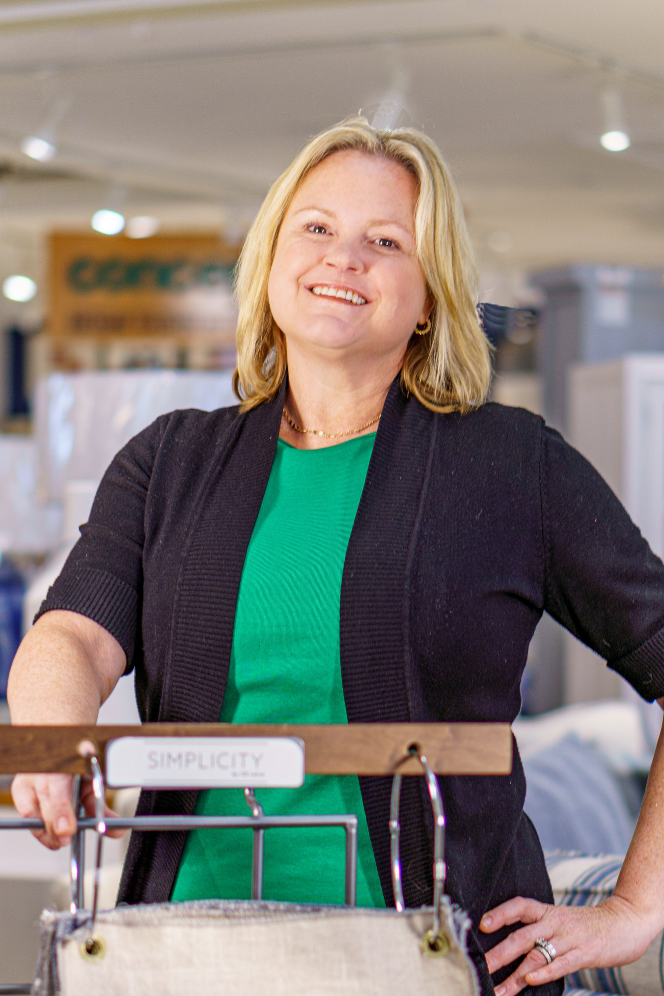 a woman standing in front of a machine