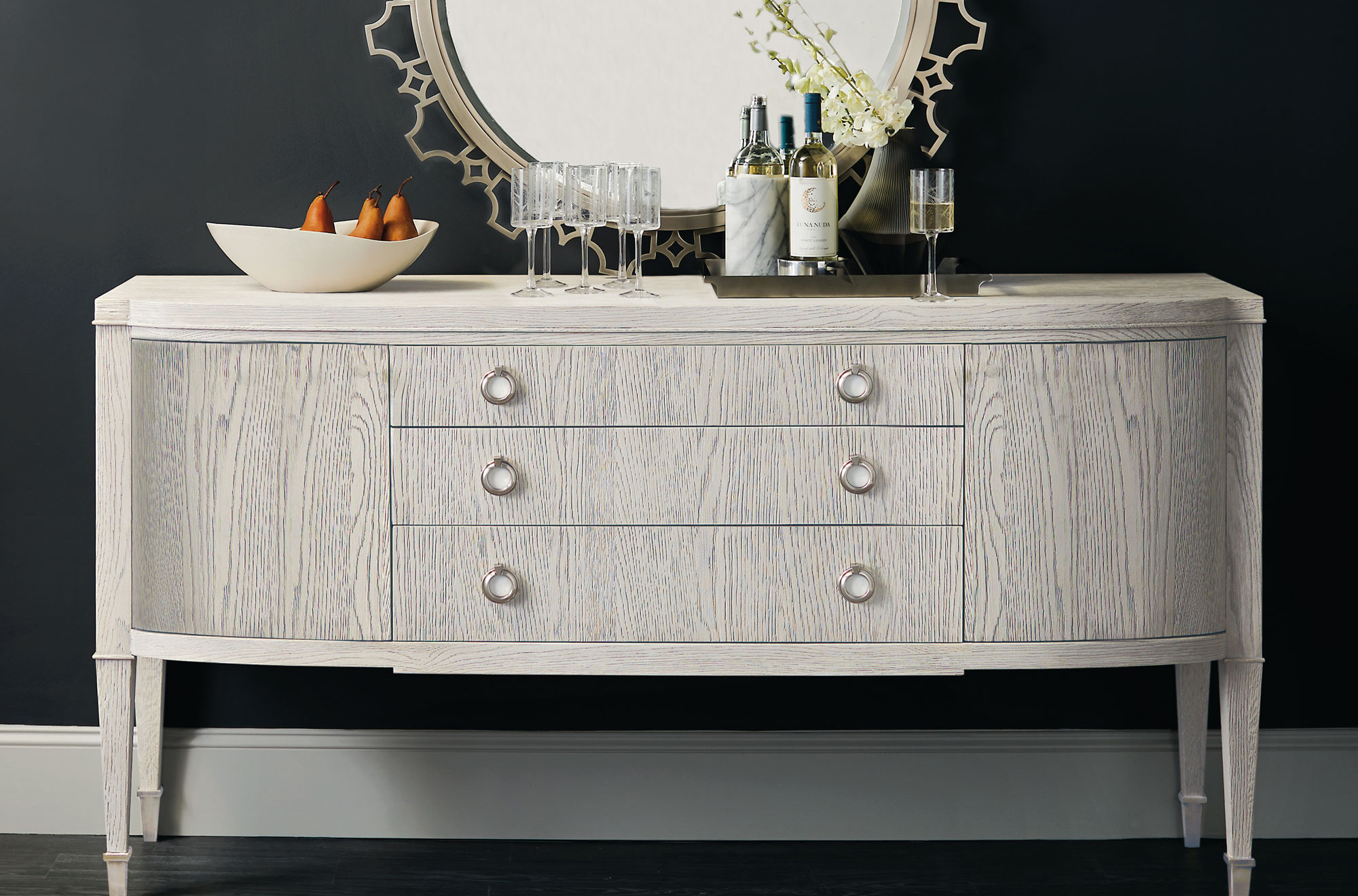 a white dresser with a mirror on top of it