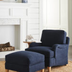 Thumbnail of http://a%20living%20room%20with%20a%20blue%20chair%20and%20ottoman