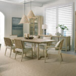 Thumbnail of http://a%20dining%20room%20table%20with%20chairs%20and%20a%20vase