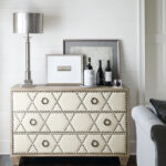 Thumbnail of http://a%20living%20room%20with%20a%20couch%20and%20a%20white%20dresser