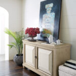 Thumbnail of http://a%20wooden%20cabinet%20with%20flowers%20on%20top%20of%20it