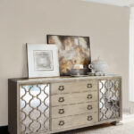 Thumbnail of http://a%20silver%20dresser%20with%20pictures%20on%20top%20of%20it