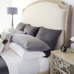 Thumbnail of http://a%20bedroom%20with%20a%20bed,%20night%20stand%20and%20lamp