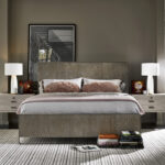 Thumbnail of http://a%20bedroom%20with%20a%20bed,%20nightstands%20and%20pictures%20on%20the%20wall