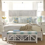 Thumbnail of http://a%20bedroom%20with%20a%20white%20bed%20and%20blue%20pillows