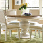 Thumbnail of http://a%20white%20table%20with%20four%20chairs%20around%20it