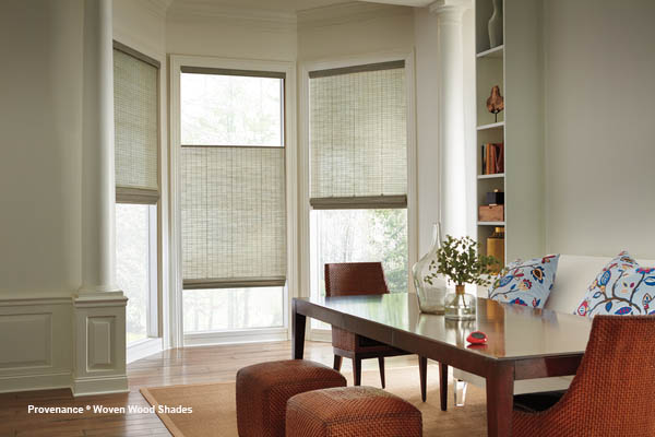 a dining room table and chairs with blinds on the windows