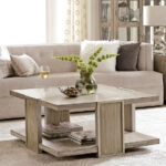 Thumbnail of http://a%20living%20room%20with%20a%20couch,%20coffee%20table%20and%20vase
