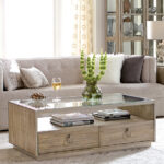 Thumbnail of http://a%20living%20room%20with%20a%20couch,%20coffee%20table%20and%20a%20glass%20of%20wine