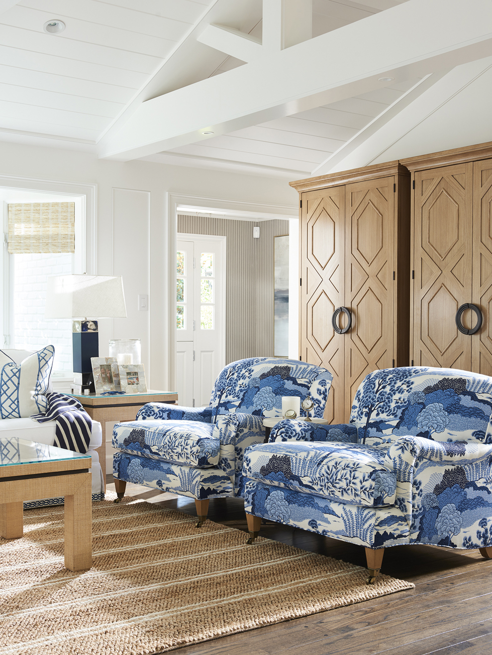 a living room with blue and white furniture