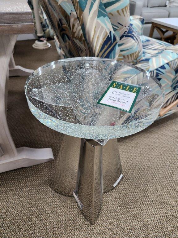 a glass table with a sign on it