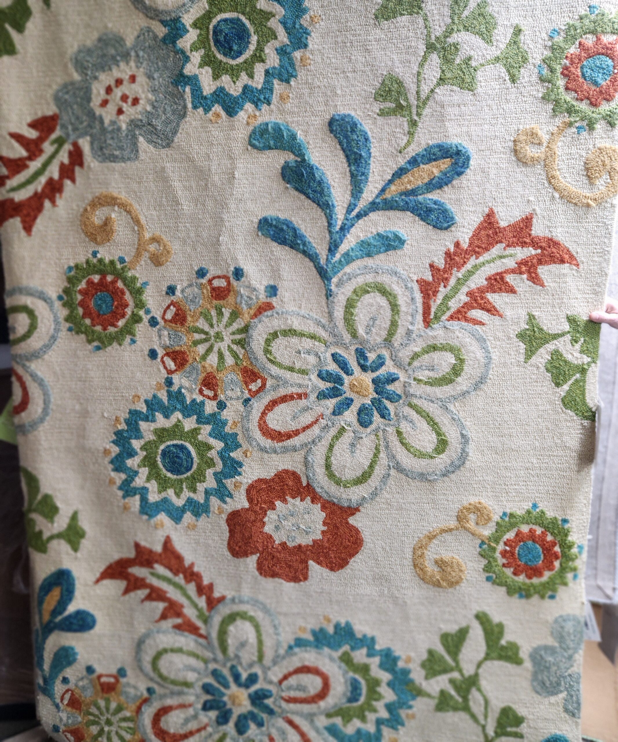 a close up of a flowered fabric with many colors