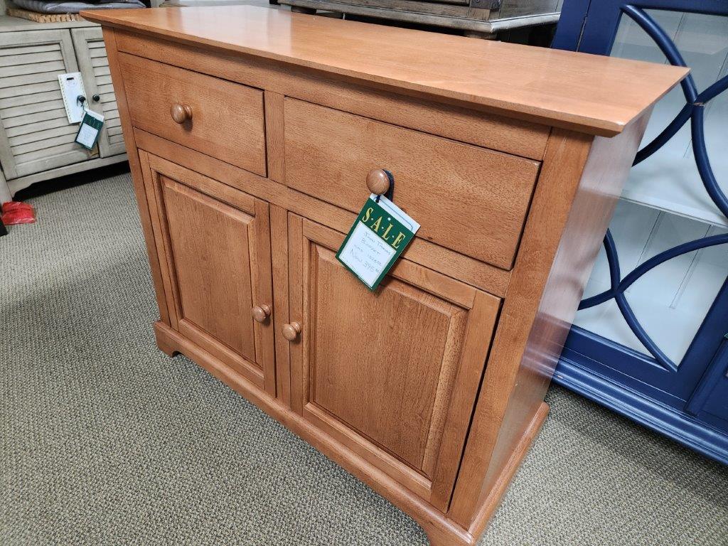 a wooden cabinet with a price tag on it