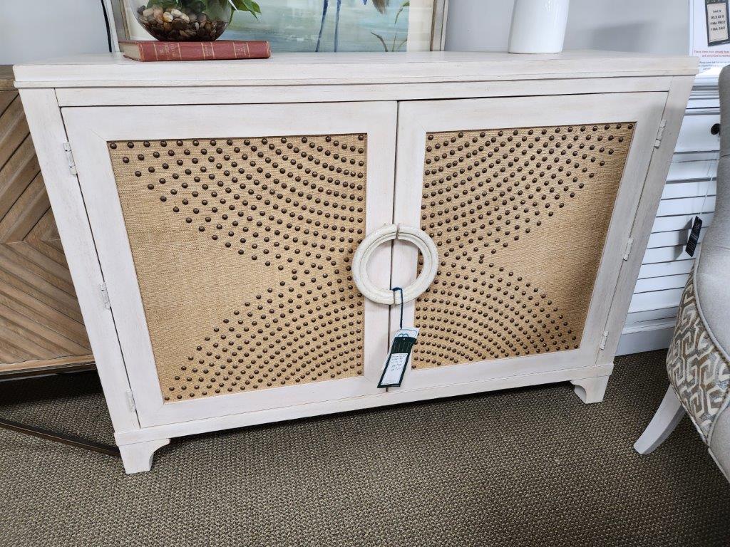 a white cabinet with a ring handle on it