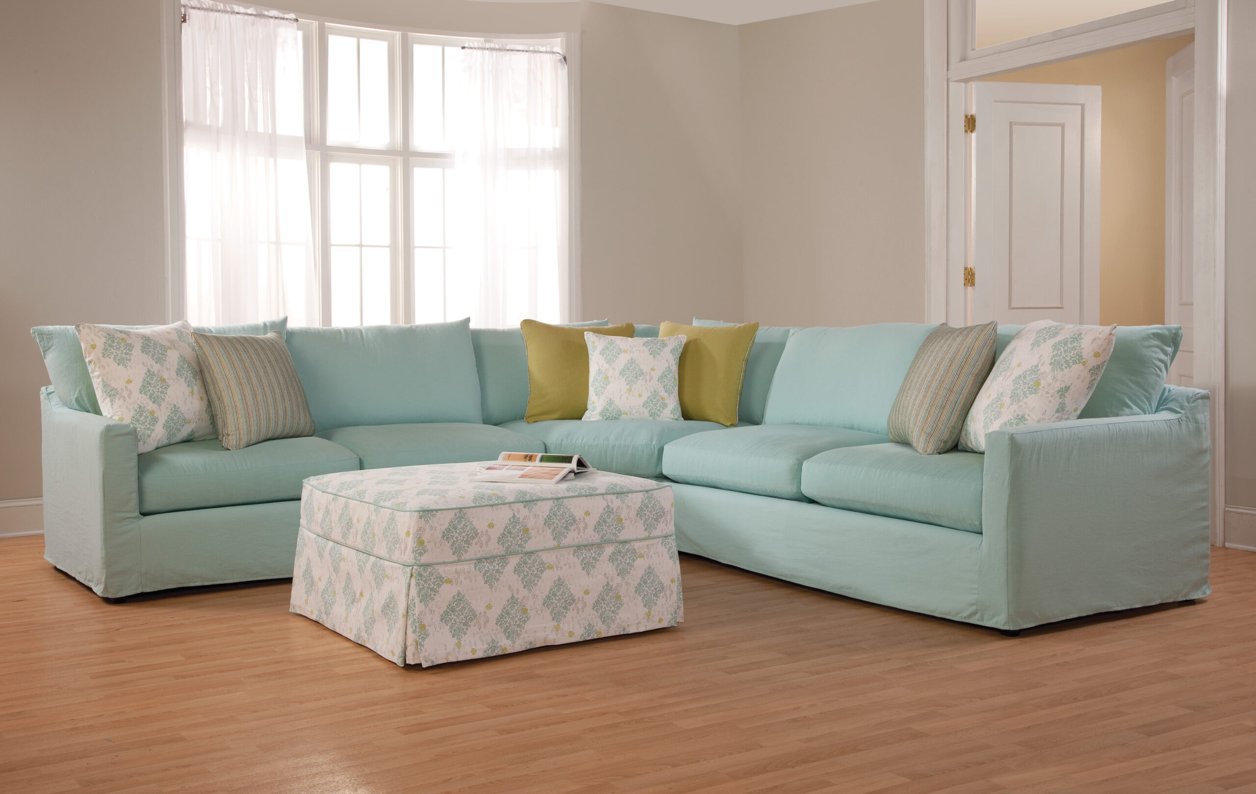 a living room filled with furniture and a large window