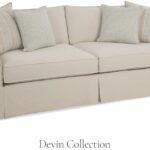 Thumbnail of http://a%20white%20couch%20with%20pillows%20on%20top%20of%20it