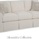 Thumbnail of http://a%20white%20couch%20with%20two%20pillows%20on%20top%20of%20it