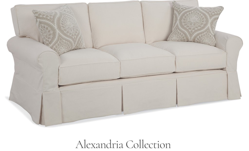 a white couch with two pillows on top of it