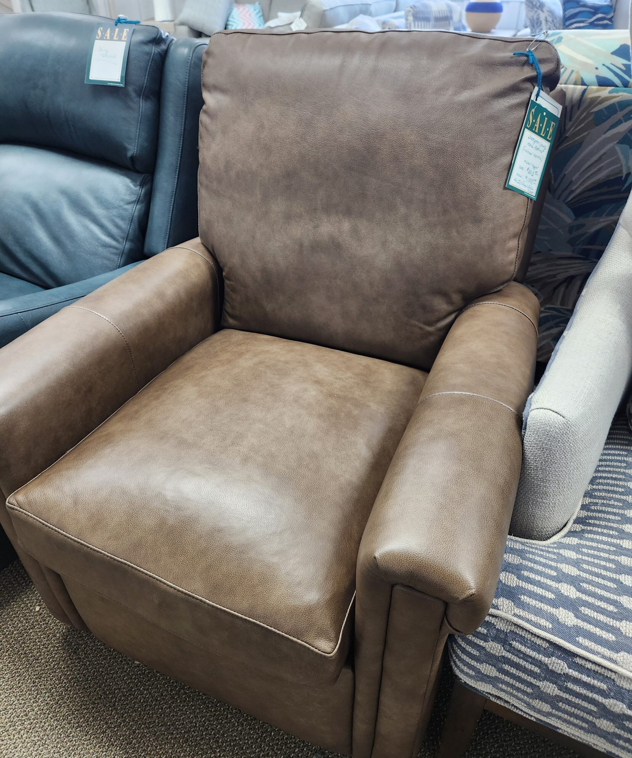 a close up of a recliner with pillows on it