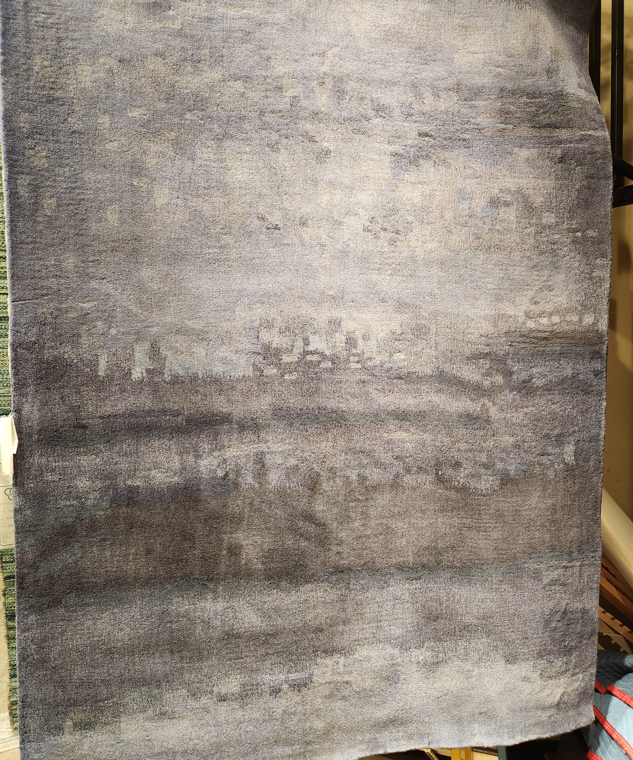 a large piece of gray colored carpet on top of a table