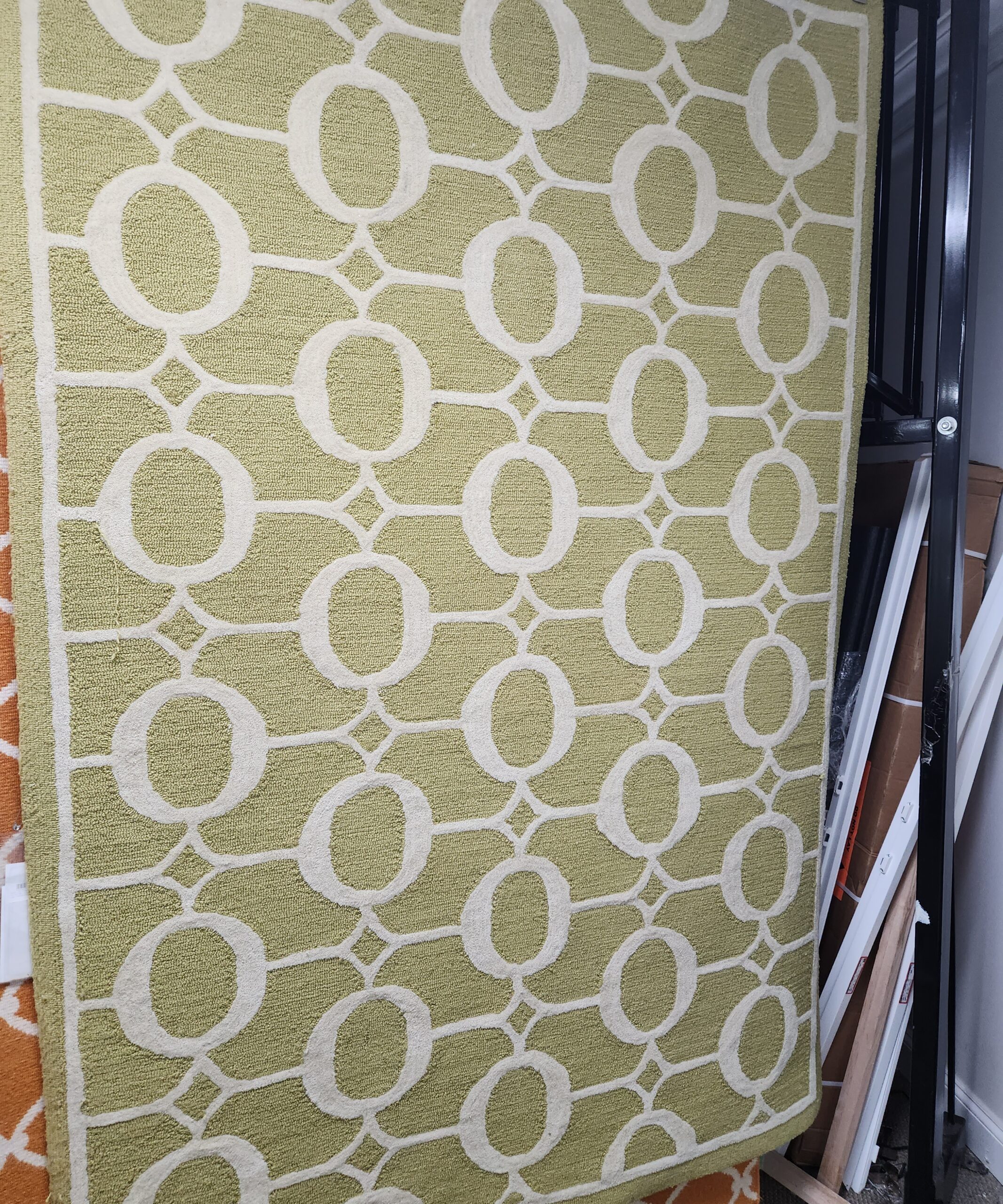 a green rug with white circles on it