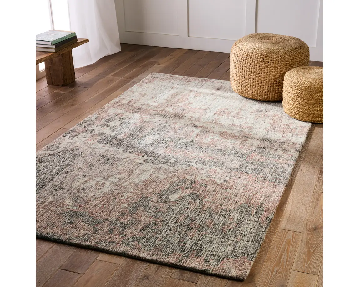 a large rug with an abstract design on the floor