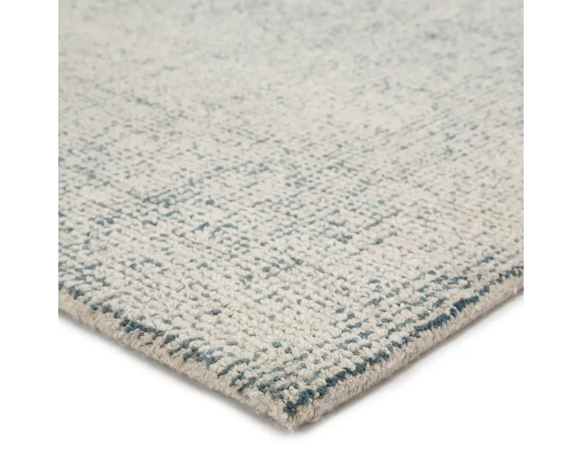 a white rug with blue and grey squares