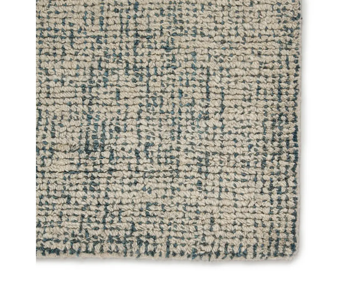 a white and blue rug on a white background