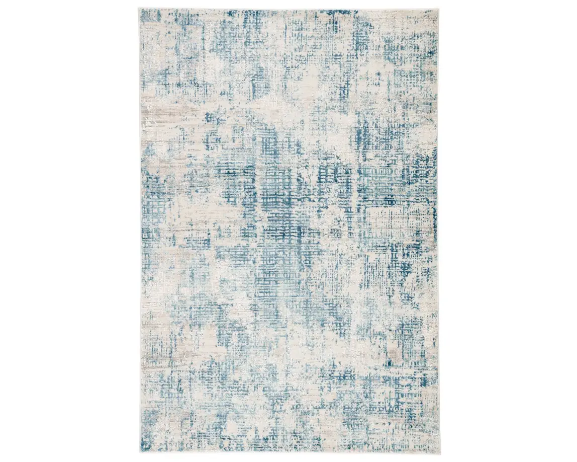 a blue and white rug with an abstract design