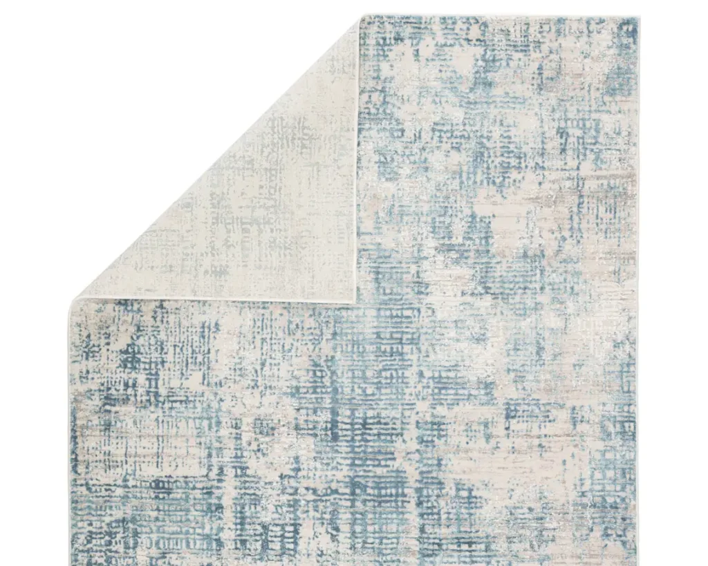 Thumbnail of http://a%20blue%20and%20white%20area%20rug%20with%20an%20abstract%20design