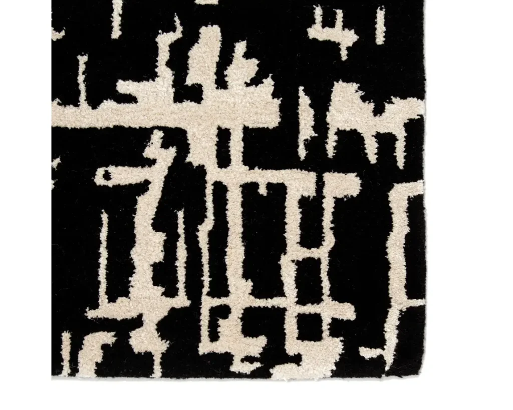 Thumbnail of http://a%20black%20and%20white%20rug%20with%20an%20abstract%20design