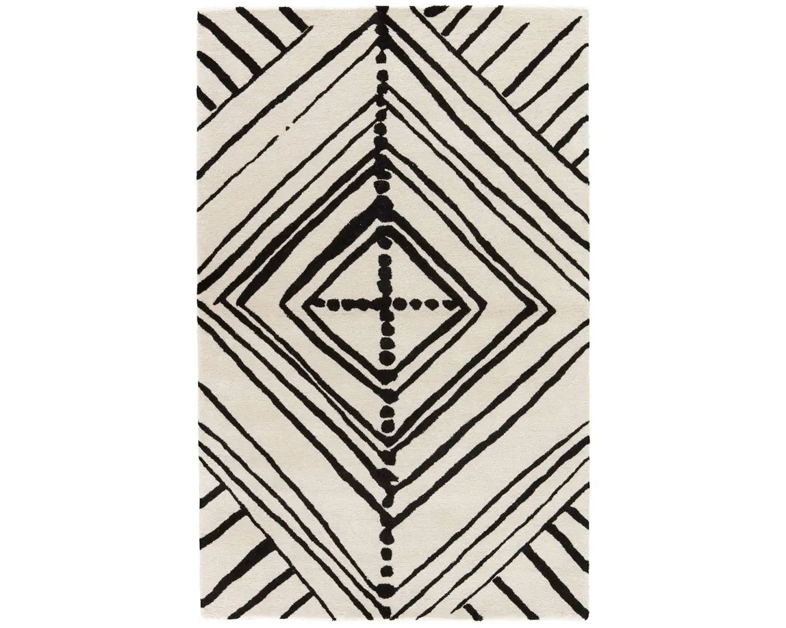 a black and white rug with an abstract design