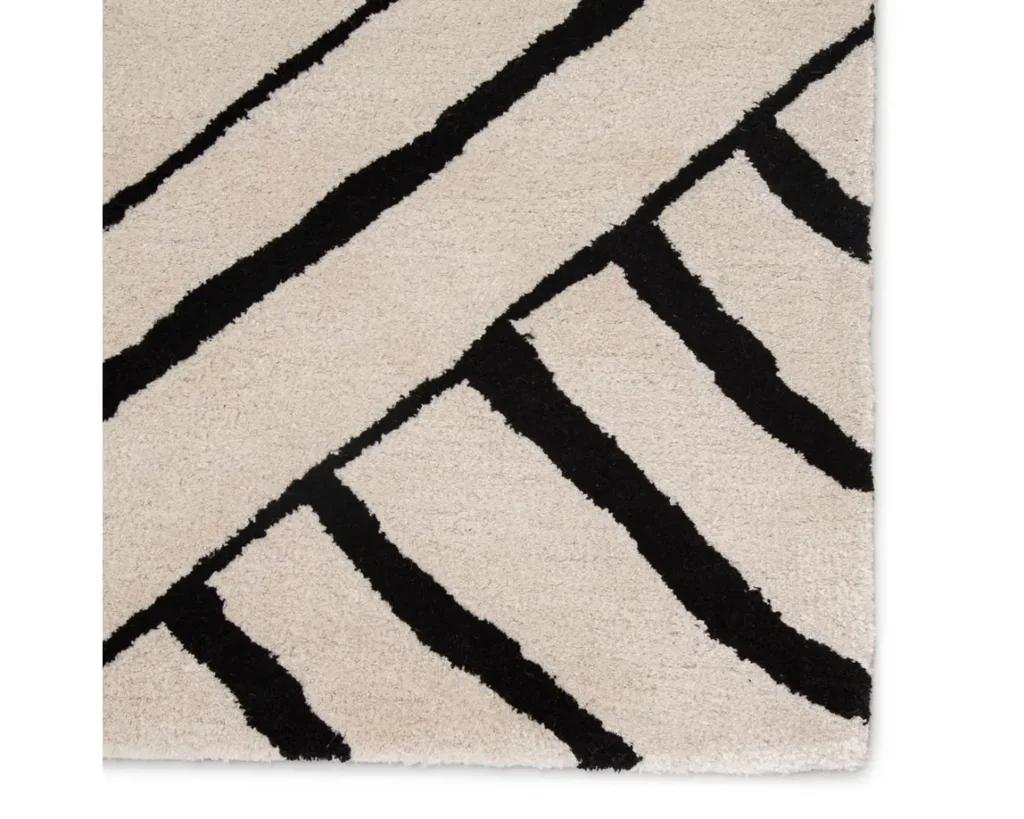 Thumbnail of http://a%20rug%20with%20black%20and%20white%20stripes%20on%20it