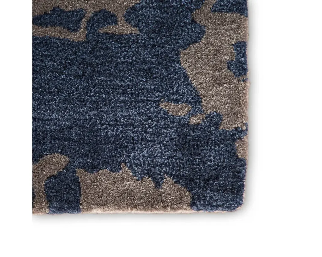 Thumbnail of http://a%20blue%20rug%20with%20grey%20and%20brown%20designs%20on%20it