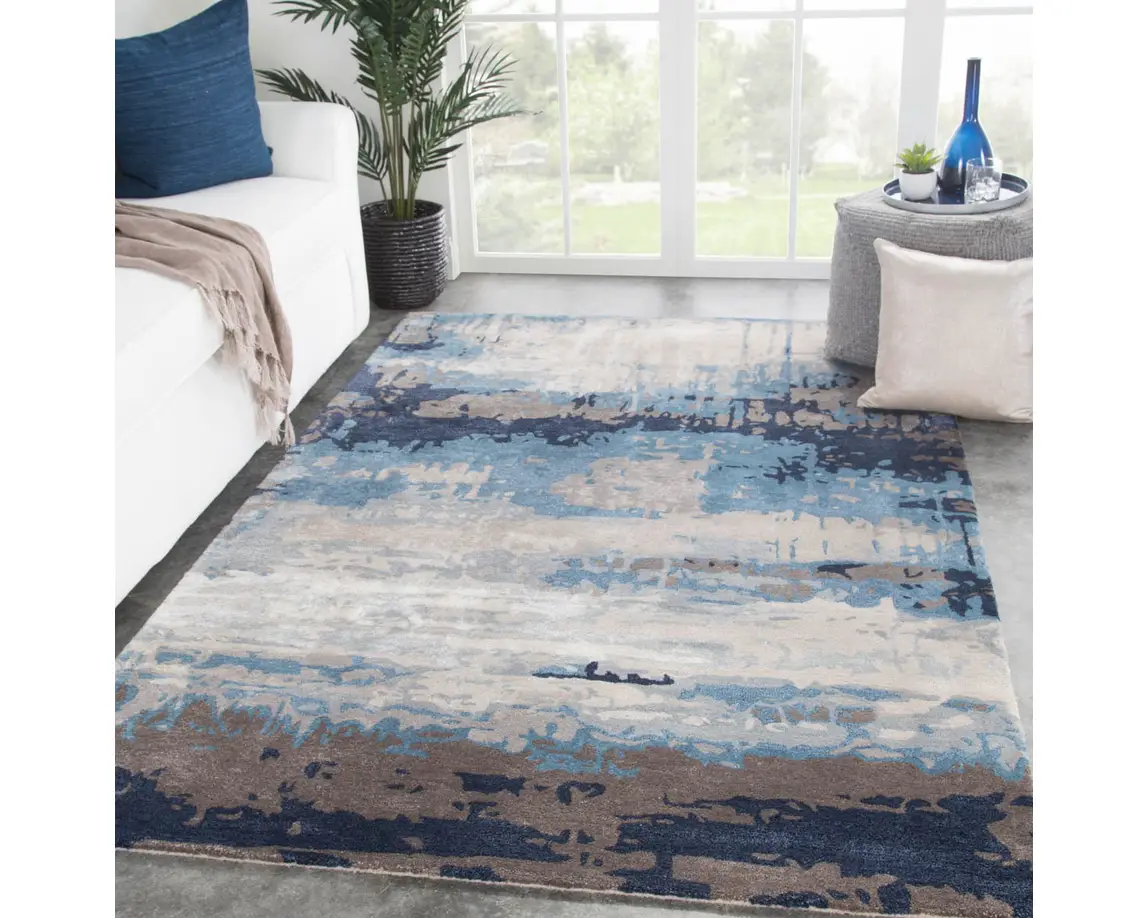 a blue and beige rug in a living room