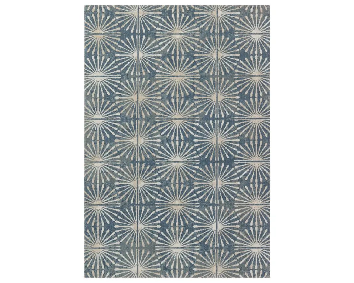 a blue and white rug with an intricate design