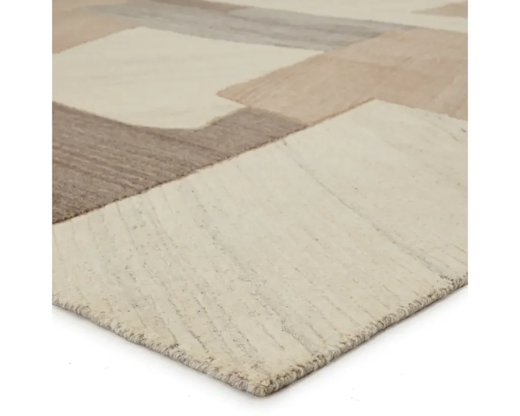 Thumbnail of http://a%20beige%20and%20brown%20rug%20with%20squares%20on%20it