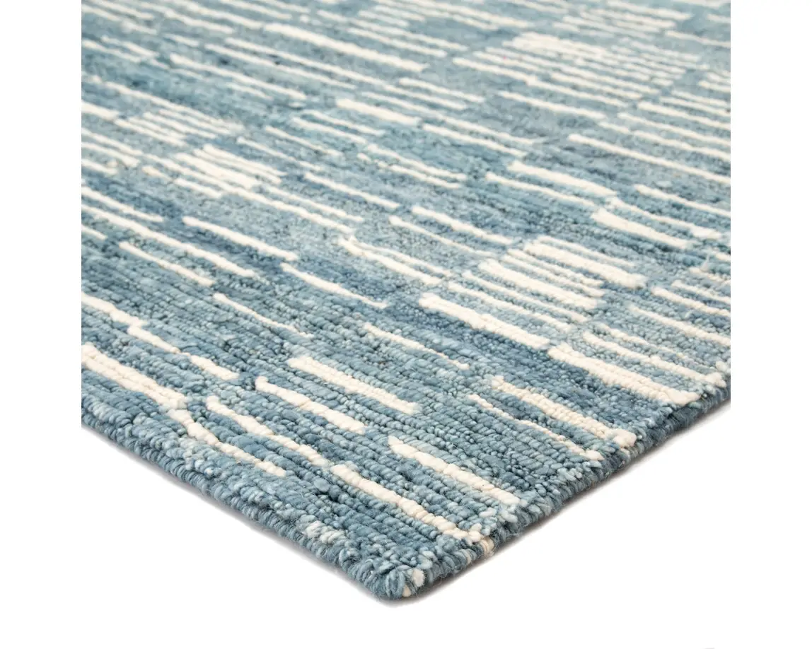 a blue and white rug on a white background